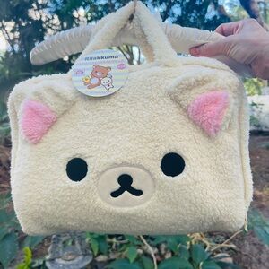 Rilakkuma Travel plush bag unzips all around; lite pink satin interior